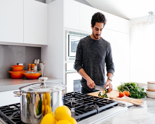 Person preparing a quick and balanced lunch in a bright modern kitchen